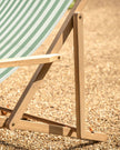Sage green Creta wooden stripped garden chair by Gallery Direct, featuring a stylish outdoor seating design.