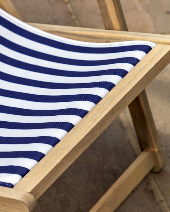Creta wooden stripped garden chair in navy blue by Gallery Direct, featuring a modern design with wooden slats and sturdy frame.