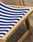 Creta wooden stripped garden chair in navy blue by Gallery Direct, featuring a modern design with wooden slats and sturdy frame.