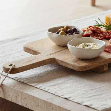 Extra Large Footed Serving Tapas Board, wooden handled board with small bowls on a kitchen table
