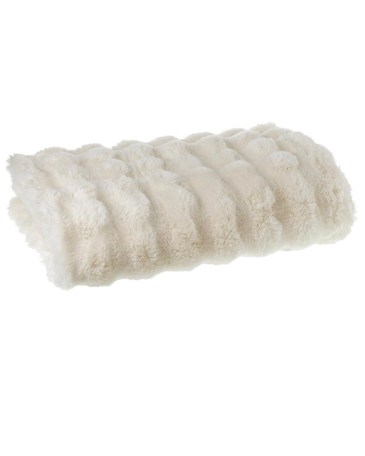 Rolled-up beige towel on a white background