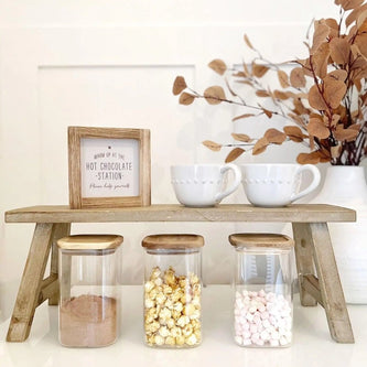 Natural wooden rustic display bench with farmhouse styling