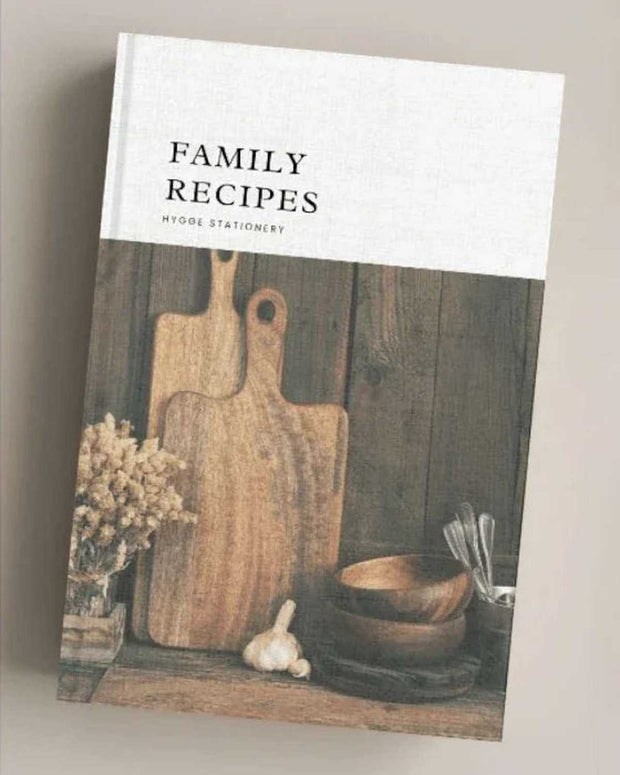 Book titled 'Family Recipes' with a wooden cutting board and kitchen items on the cover.