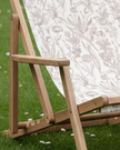 Creta wooden floral deck chair in beige from Gallery Direct, outdoor garden furniture with a floral design and wooden frame.