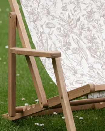 Creta wooden floral deck chair in beige from Gallery Direct, outdoor garden furniture with a floral design and wooden frame.