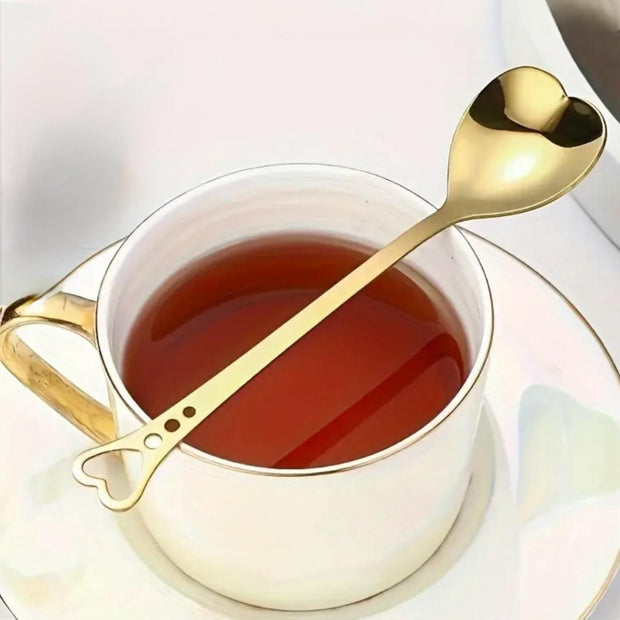 Starlight Express gold heart handle spoon for kitchen and dining, featuring a decorative gold heart-shaped handle.
