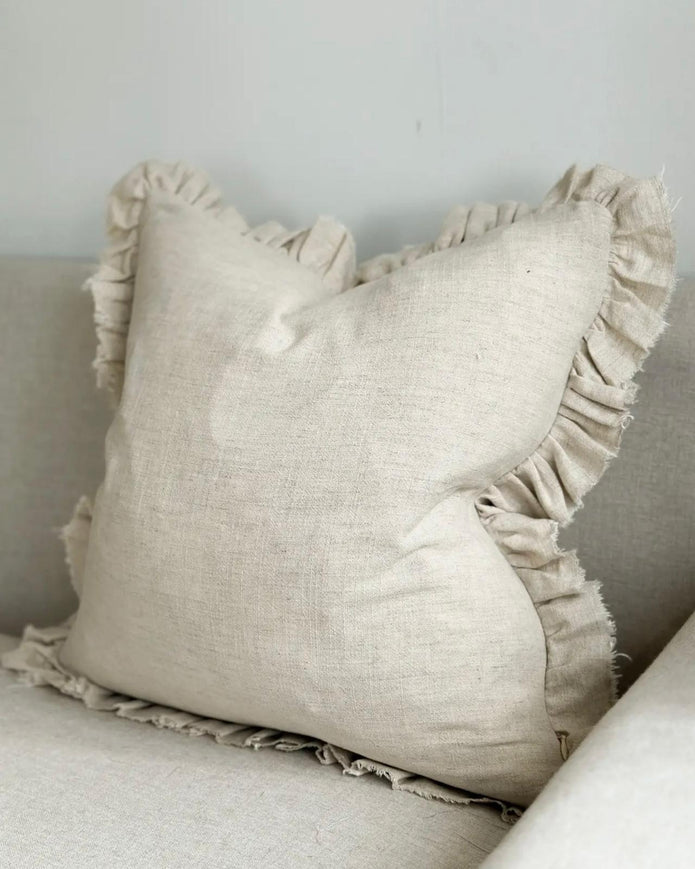 Grace beige square ruffle cushion cover by Ellenvale Trade, shown on an extra large soft furnishing cushion.