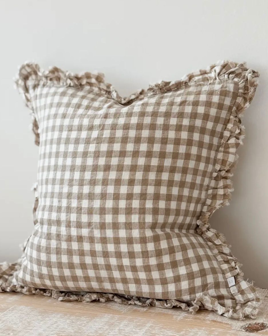 Brown square gingham cushion cover with soft furnishings design, featuring a classic checkered pattern and tailored edges.