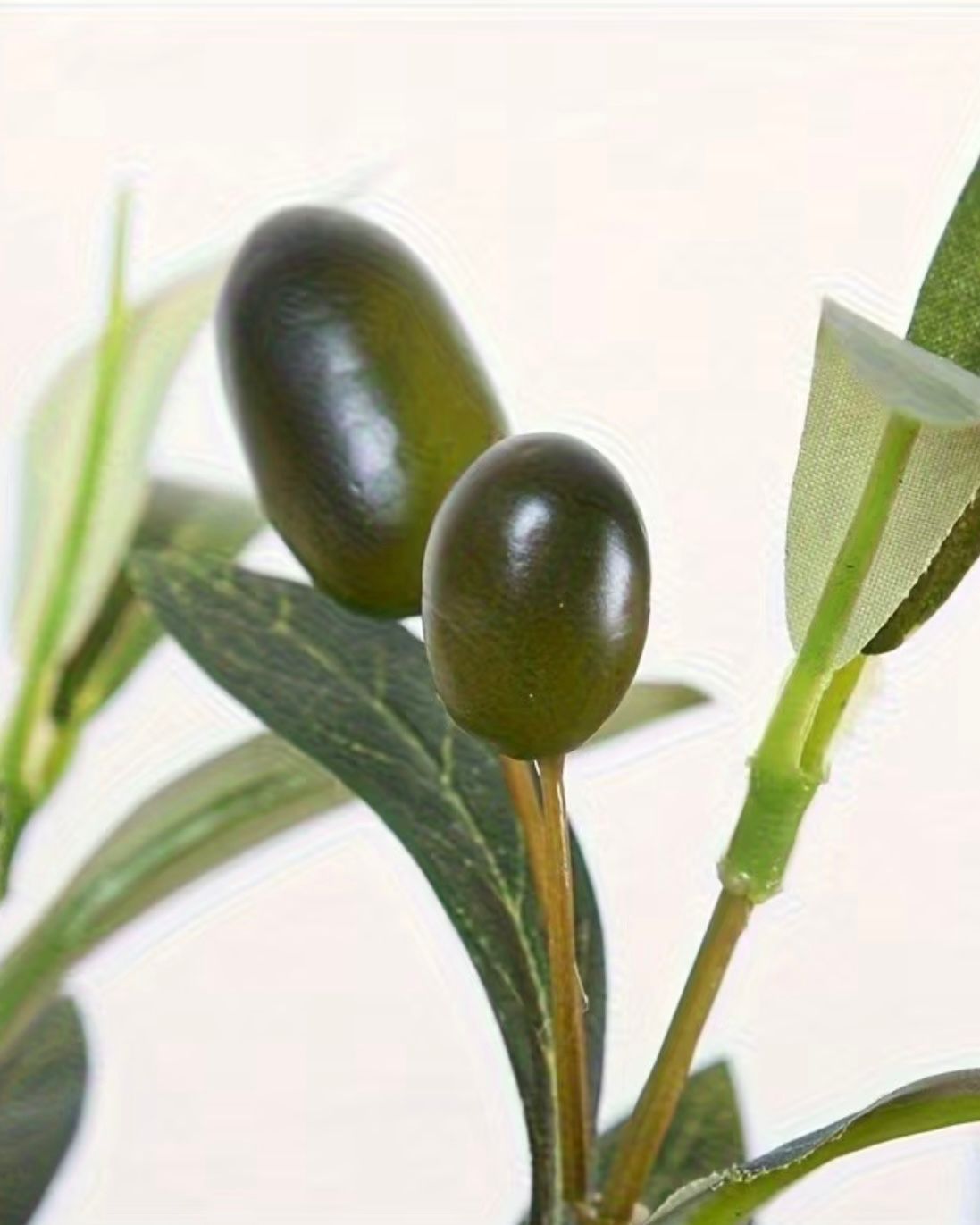 Mini artificial olive branch from Starlight Express with realistic green leaves, ideal for decorative plant arrangements.