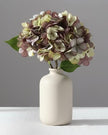 Artificial dusky plum hydrangea stem from Starlight Express, showcasing vibrant, lifelike hydrangea blossoms on a realistic plant stem.