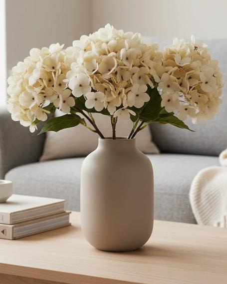 Artificial soft cream hydrangea stem from Starlight Express, featuring short, full blooms perfect for decorative floral arrangements.