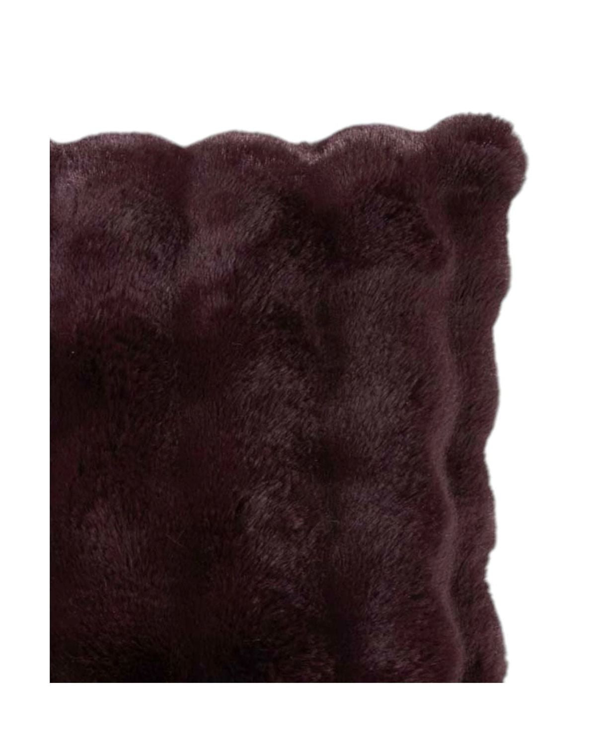 Close-up of a dark brown fur pillow on a white background