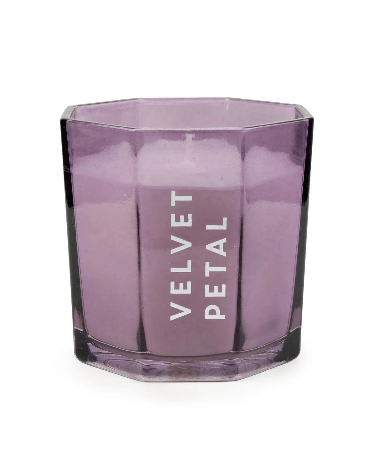 Hexagonal purple candle with 'Velvet Petal' text on a white background