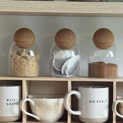 Starlight Express glass cork ball lidded pantry storage jar for kitchen and dining, showcasing clear glass with cork lid and stored items inside.