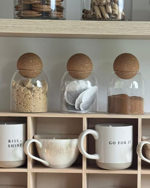 Starlight Express glass cork ball lidded pantry storage jar for kitchen and dining, showcasing clear glass with cork lid and stored items inside.