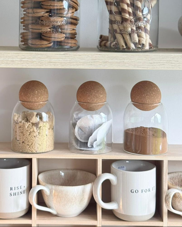 Starlight Express glass cork ball lidded pantry storage jar for kitchen and dining, with a clear glass body and cork lid.