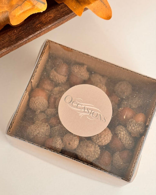 Box of chocolates with 'Occasions' branding on a white surface.