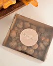 Box of chocolates with 'Occasions' branding on a white surface.