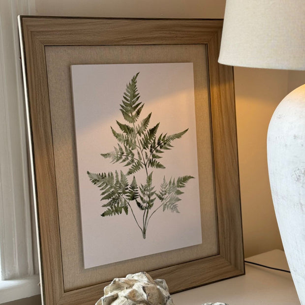 Wooden framed wall art print of vibrant green ferns by Hill Interiors, showcasing botanical botanical decor for interior design.