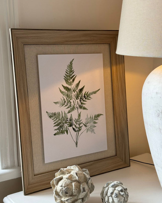 Wooden framed wall art print featuring vibrant green ferns, designed by Hill Interiors for natural home decor.