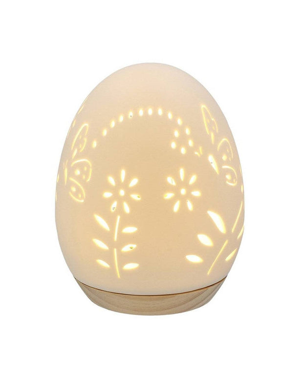 Decorative egg-shaped lamp with floral patterns on a white background