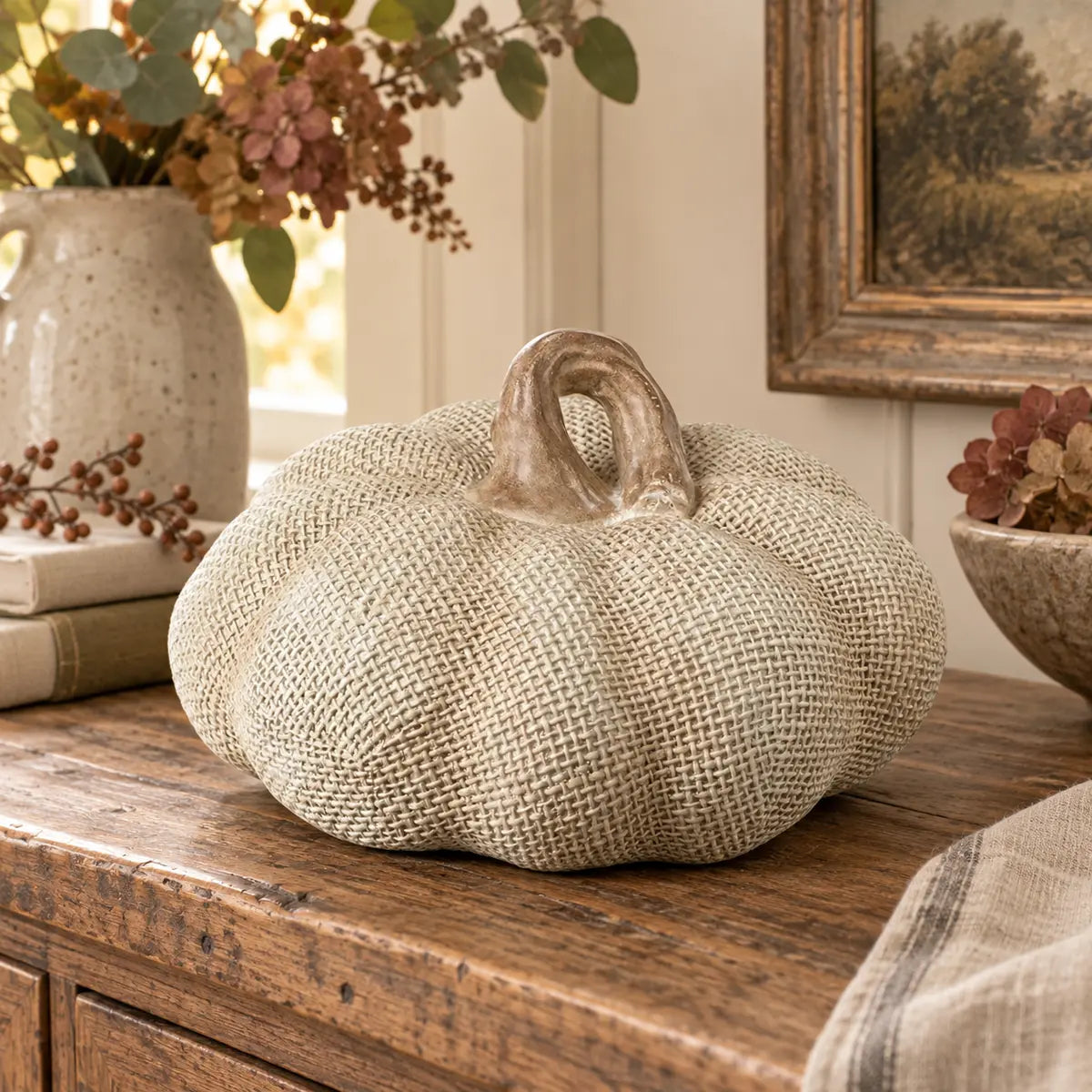 Neutral resin Hessian effect pumpkin for autumn decor by Heaven Sends, featuring a textured hessian surface and pumpkin shape.