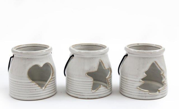 White Ceramic Tealight Holder With Handle, three cream lanterns with heart, star and tree cutouts