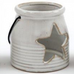 White Ceramic Tealight Holder With Handle, close-up of the cream star-cutout lantern