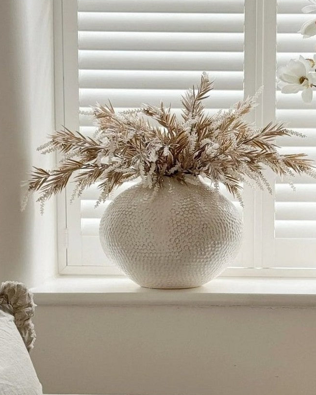Ivory textured caldron vase by Hill Interiors with a rounded, decorative shape suitable for modern home decor.