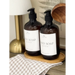 Starlight Express acrylic soap dispenser and handwash tray set for home decor, featuring sleek transparent bottles and matching tray.