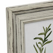 Close-up of Alba frame's distressed wooden finish and stepped mitred corner