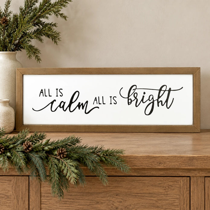 All Is Calm All Is Bright wooden Christmas sign on an oak console