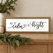 All Is Calm All Is Bright wooden Christmas sign on an oak console