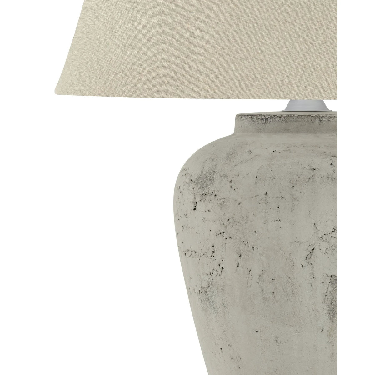 Amesbury medium stone lamp by Hill Interiors, featuring a textured stone base and classic lighting design.