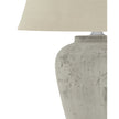 Amesbury medium stone lamp by Hill Interiors, featuring a textured stone base and classic lighting design.