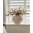 Ivory textured caldron vase by Hill Interiors with a rounded, decorative shape suitable for modern home decor.