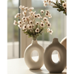 Artificial Daisy Flower Stem in Peach by Starlight Express, realistic faux plant with vibrant peach-colored petals and green stem.