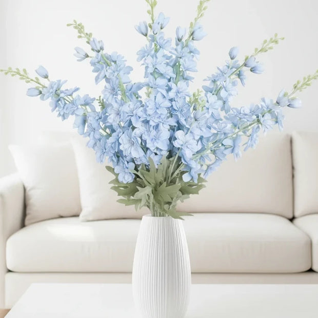 Artificial tall ocean blue lupin flower stem from Starlight Express, showcasing vibrant blue, realistic flower details, and greenery.