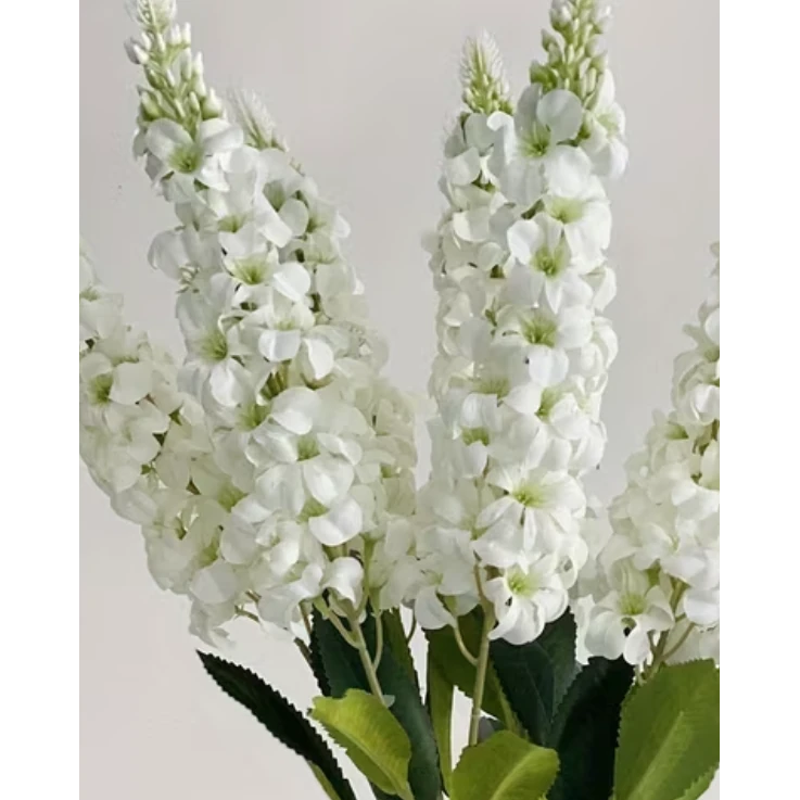 Artificial tall white Lupin stem from Starlight Express, realistic faux plant with delicate white flowers and green foliage.