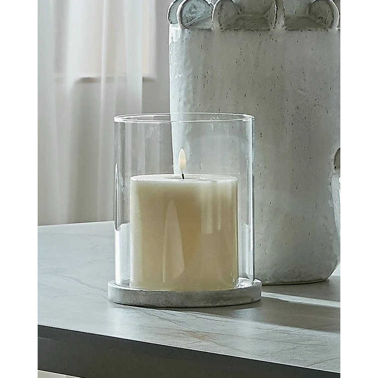 Natural stone hurricane candle lantern for home decor by Hill Interiors, featuring a clear glass enclosure and rustic design.