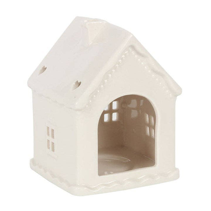 White Christmas gingerbread house tealight candle holder with festive holiday design, ideal for Christmas decor and cozy ambiance.