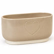Close view of the outlined heart, beige glaze and cream base