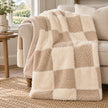 Riva Home beige and cream fur boucle check blanket throw draped over an armchair