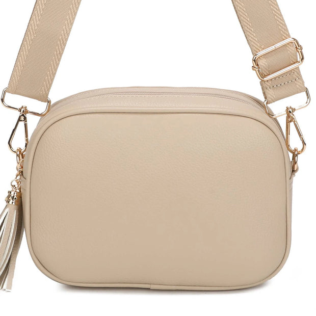 Beige Double Zip Crossbody Bag, close-up of the beige bag, tassel and gold-coloured clips