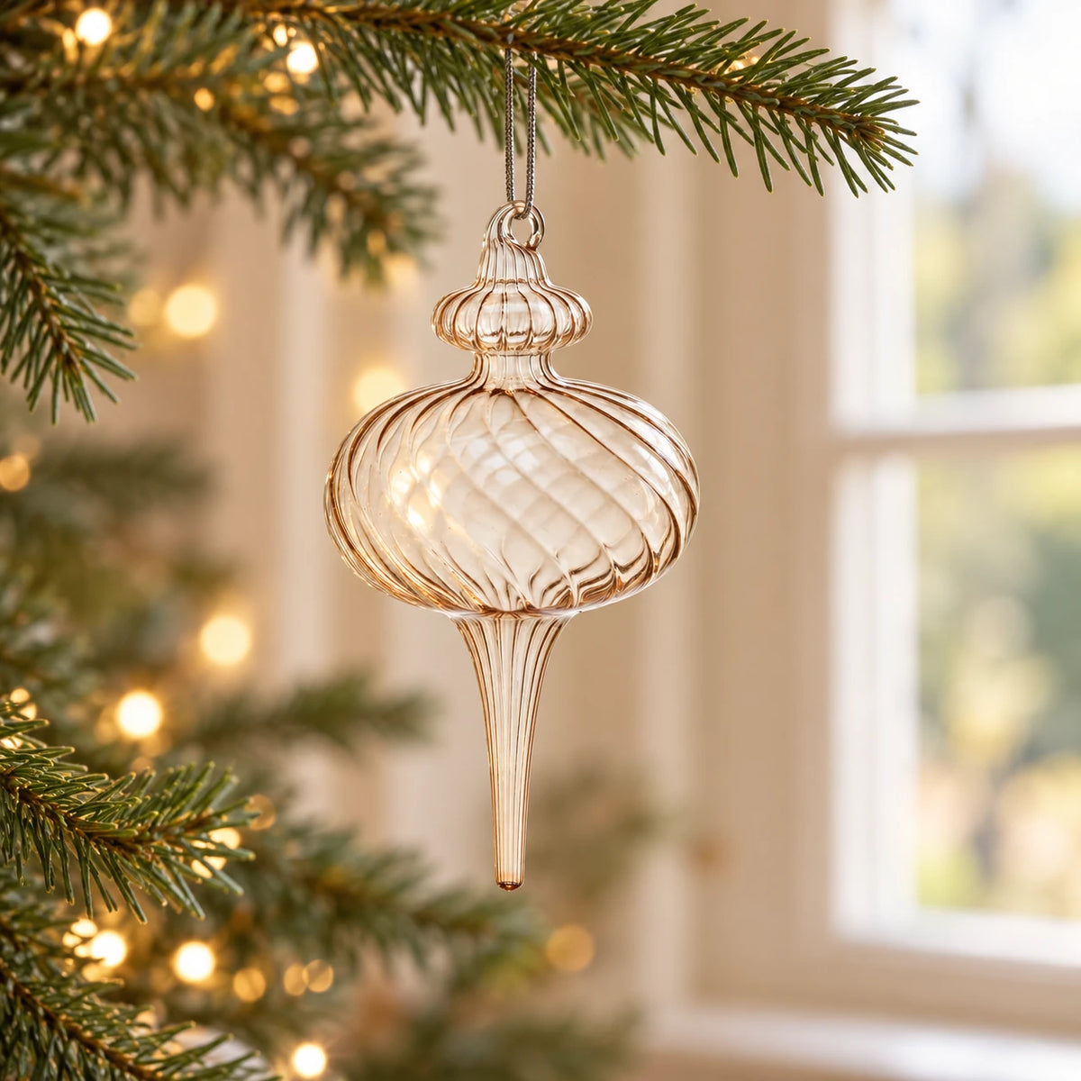 Beige Glass Teardrop Christmas Bauble — Single RIGHT shorter finial on fir branch near window