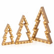 Small medium and large beige wooden LED Christmas trees on a white studio background