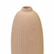 Close-up of the beige vase's textured finish, rounded shoulder and narrow rim