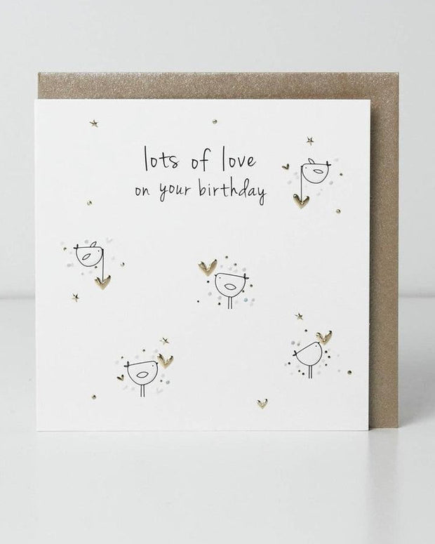 Belly Button Designs birthday greeting card titled "Lots of Love" with colorful heart illustrations and cheerful design.