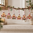 Hanging Gingerbread Houses – Set of Six styled on a warm neutral mantel