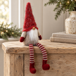 Close-up detail of Sitting Red Woolly Christmas Gonk